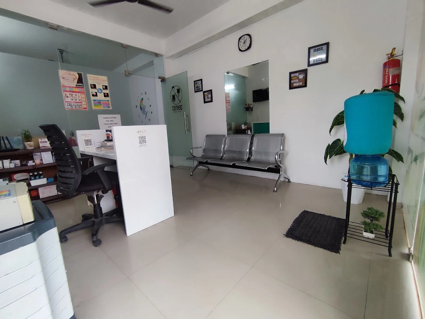 Front desk and waiting chairs inside Smile Tree Dental Clinic.